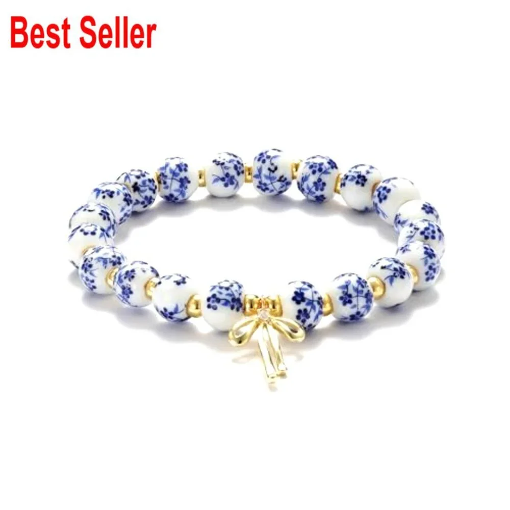 Handmade Stretch Beaded Bracelet with Gold Plated Bow Charm